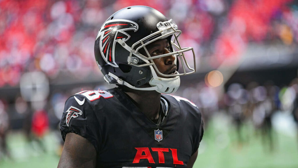 Calvin Ridley Atlanta Falcons dynamic wallpaper red black uniform helmet blurred stadium background