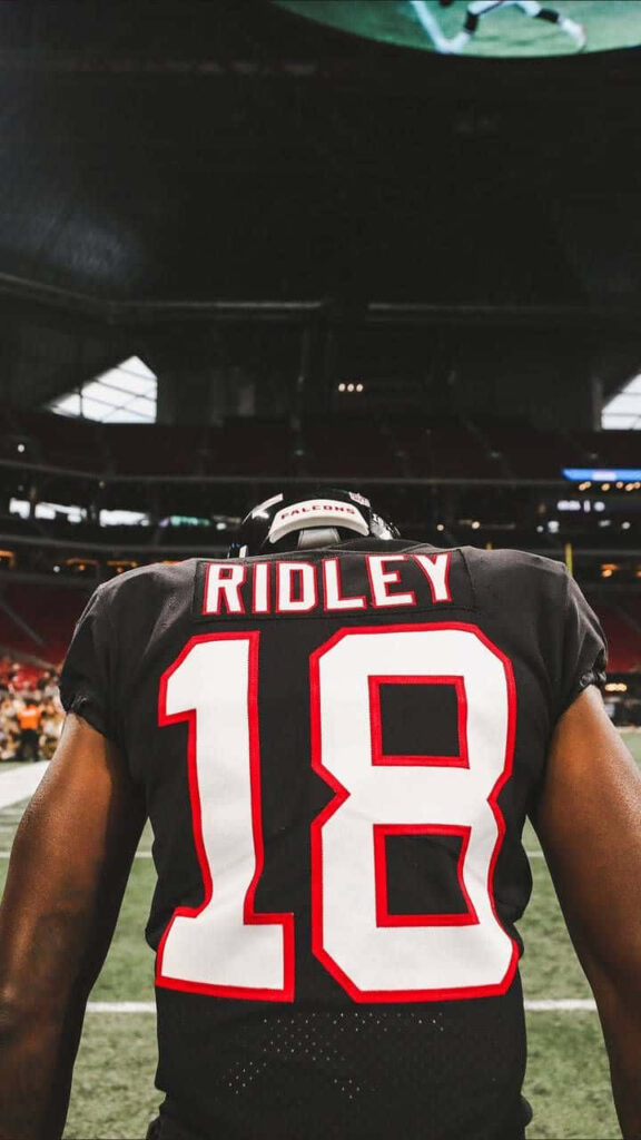 Calvin Ridley number 18 football jersey back view stadium lighting intense game wallpaper