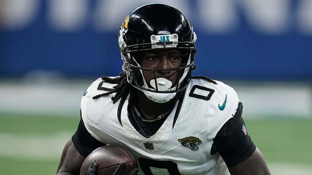 Calvin Ridley in Jacksonville Jaguars uniform mid-action football dynamic wallpaper background