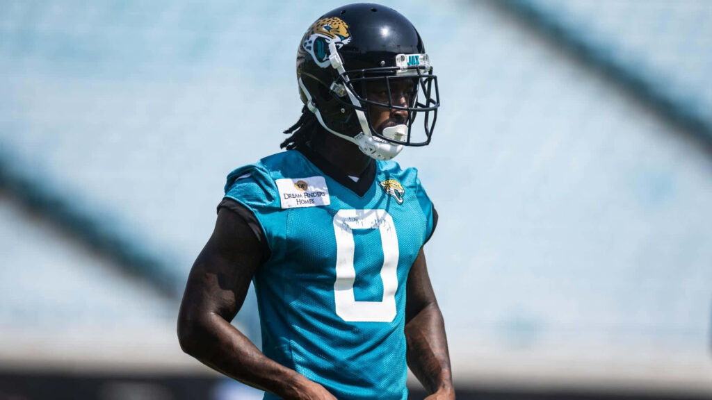 Calvin Ridley in teal Jaguars uniform training outdoors showing focus and athleticism Wallpaper