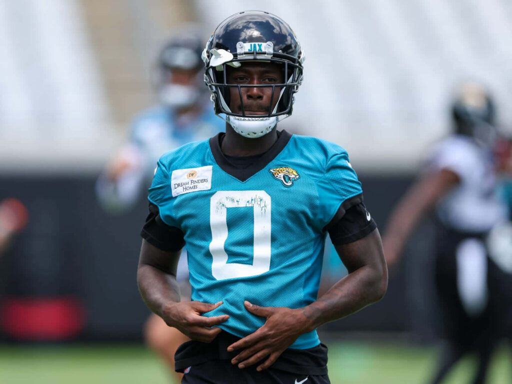 Calvin Ridley training in teal Jacksonville Jaguars jersey and helmet in stadium wallpaper