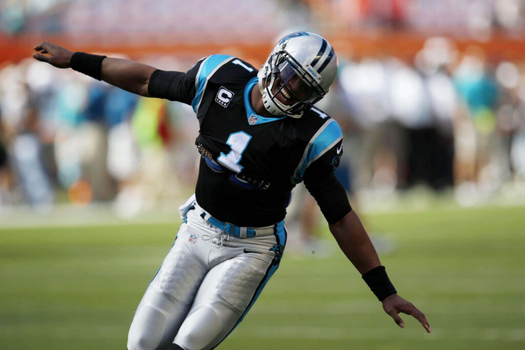 Cam Newton Panthers uniform celebrating on field vibrant black blue silver high-resolution wallpaper