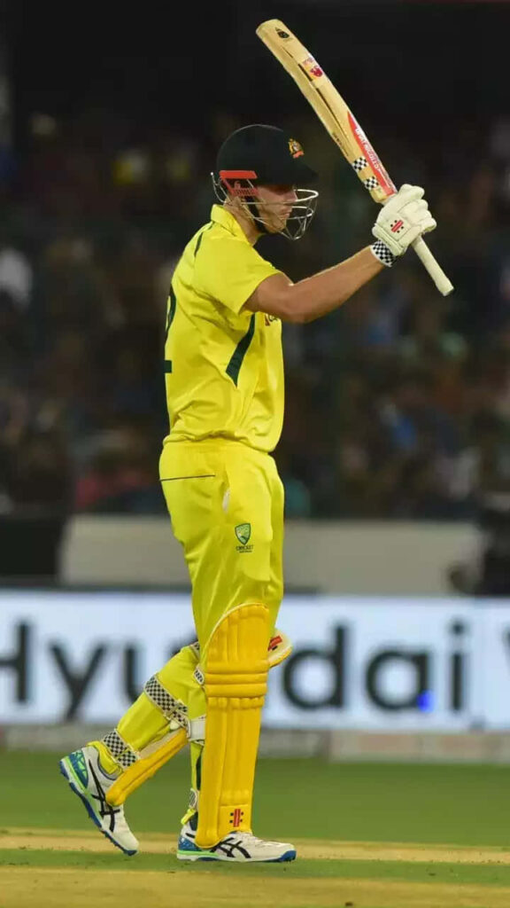 Cameron Green celebrating in yellow Australian cricket uniform minimalist wallpaper background