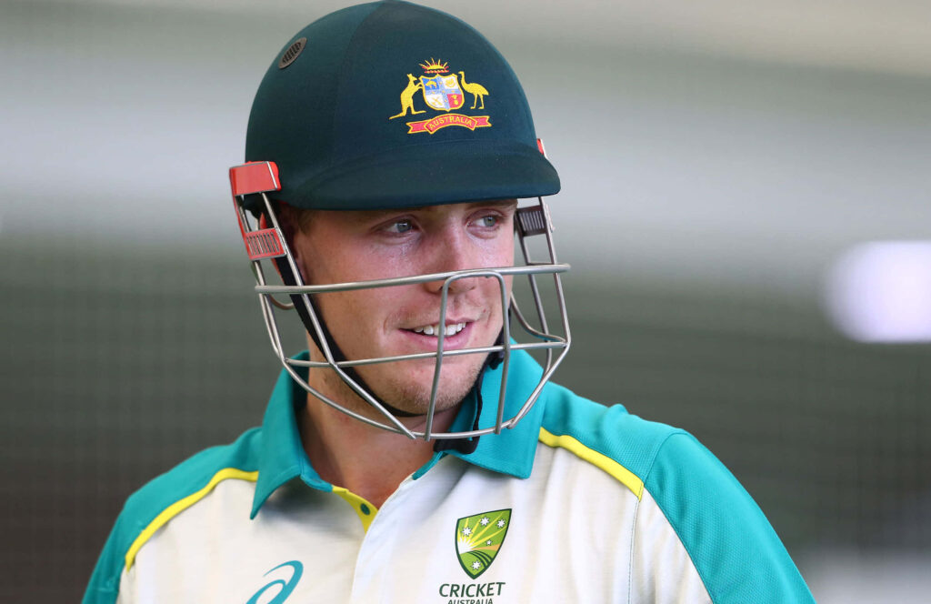 Cameron Green Australian cricketer in green cream uniform confident smile professional wallpaper