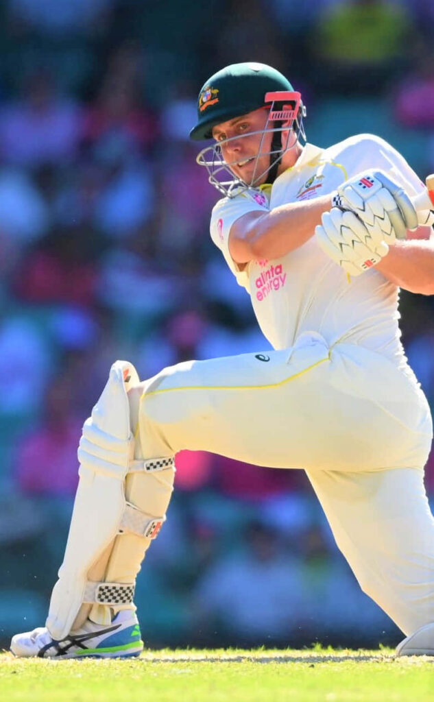 Cameron Green batting cricket action Australian whites vibrant stadium dynamic wallpaper background