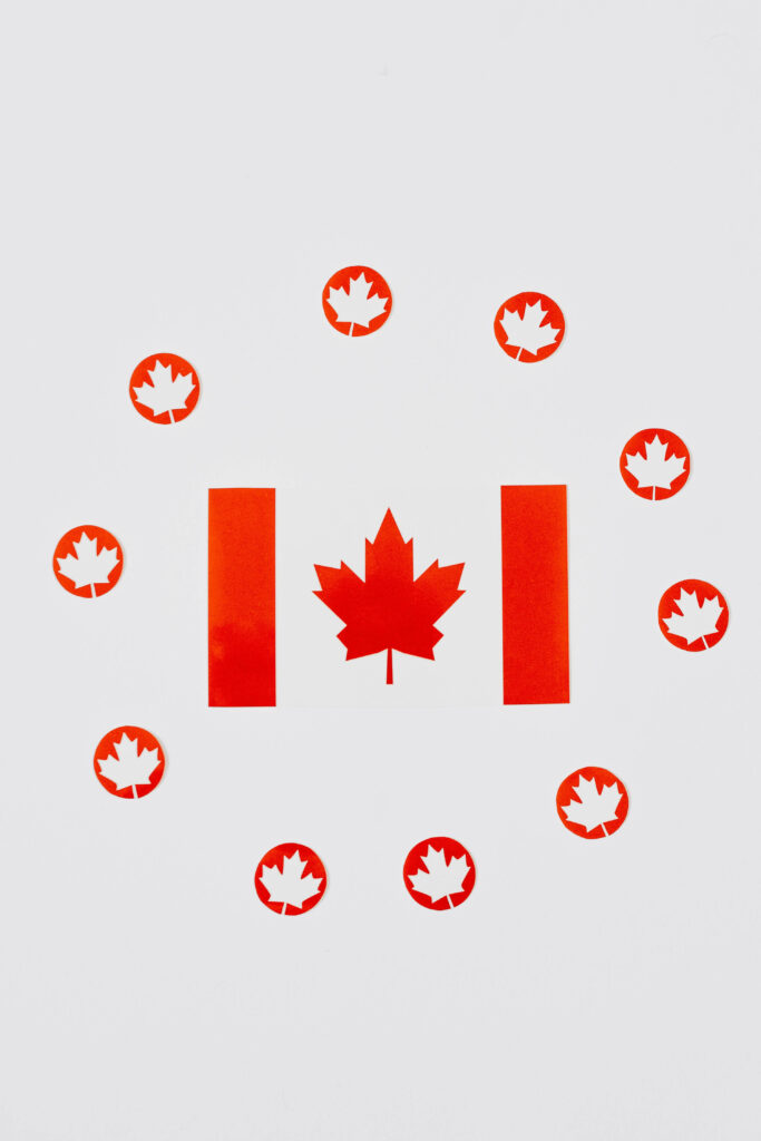 Canadian flag wallpaper with red maple leaf circle on white background symbolizing unity