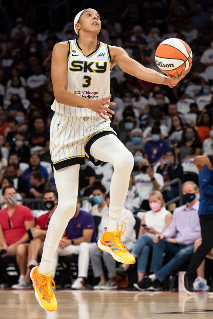 Candace Parker mid-dribble soaring in Chicago Sky uniform vibrant action shot basketball wallpaper