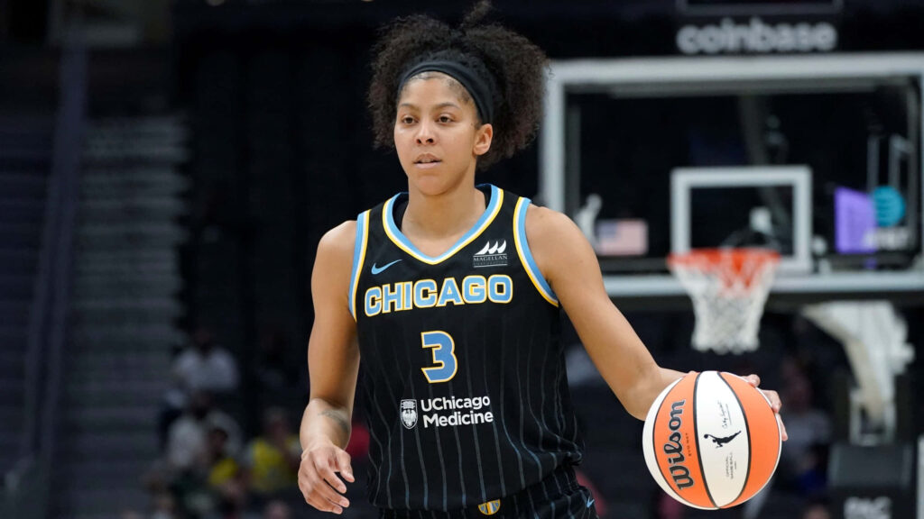 Candace Parker dribbling basketball in Chicago Sky uniform focused in dynamic game action wallpaper