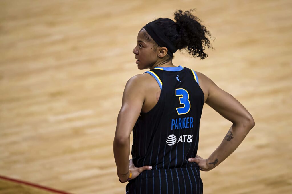 Candace Parker wearing number 3 jersey on basketball court showing focus and athletic strength Wallpaper