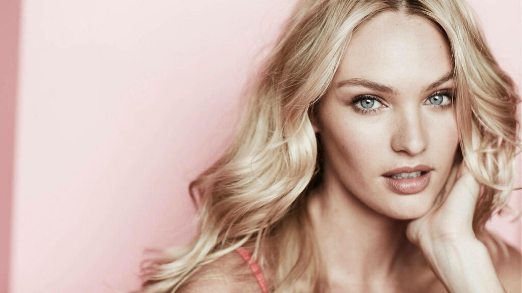 Candice Swanepoel soft blonde waves minimal makeup pink background elegant photoshoot wallpaper