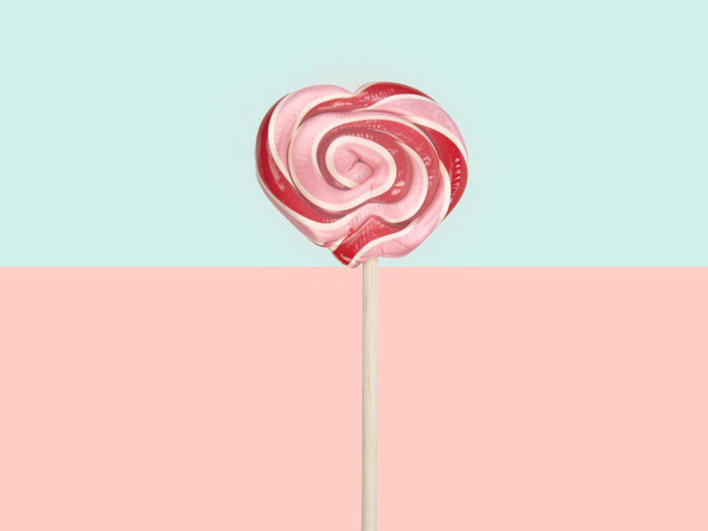 Sugary Delights: Vibrant Lollipop Against Dreamy Pastels Wallpaper