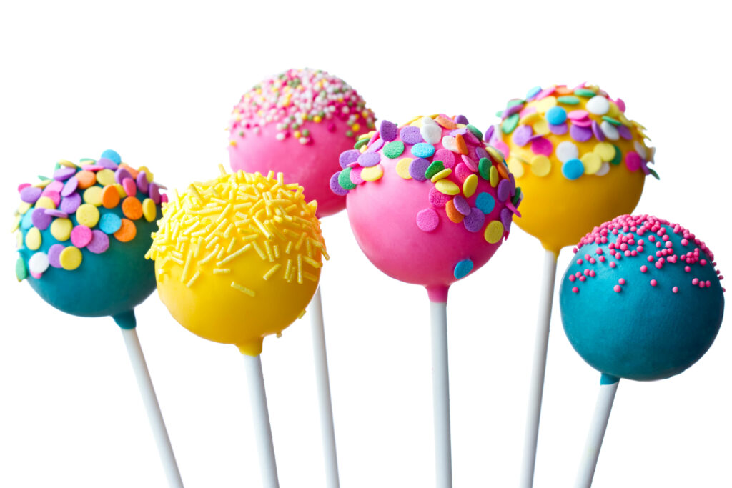 Candy-coated Delights: A Vibrant Display of Cake Pop Sticks adorned with Colorful Candies Wallpaper