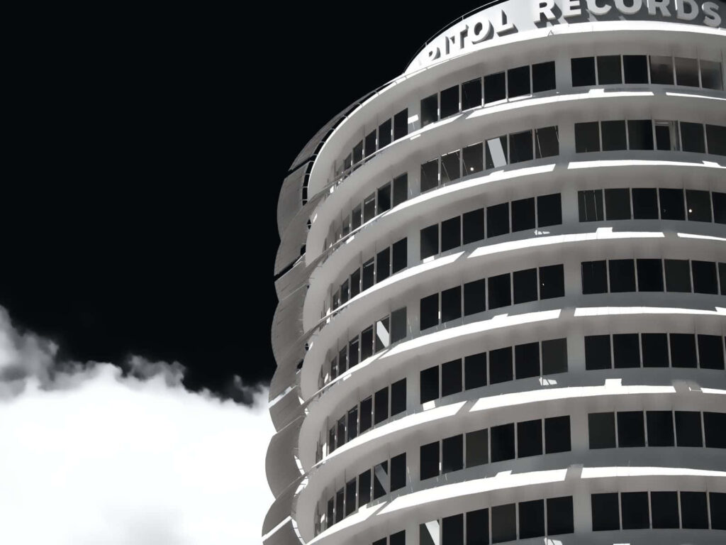 Capitol Records Building Wallpaper: Iconic Design Against Black Sky