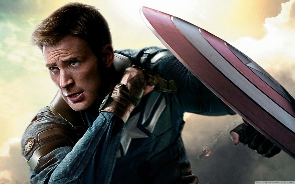 Close-up of Chris Evans as Captain America with vibrant shield and dramatic cloudy sky background Wallpaper