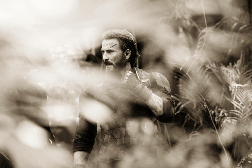 Chris Evans as Captain America in dense forest sepia tone intense Infinity War wallpaper background