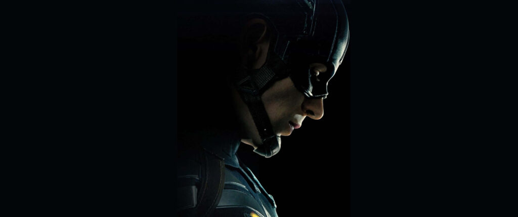 Guardian of Justice: Captain America stands tall, prepared to defend and shield the innocent with his vibranium armor and powerful shield Wallpaper