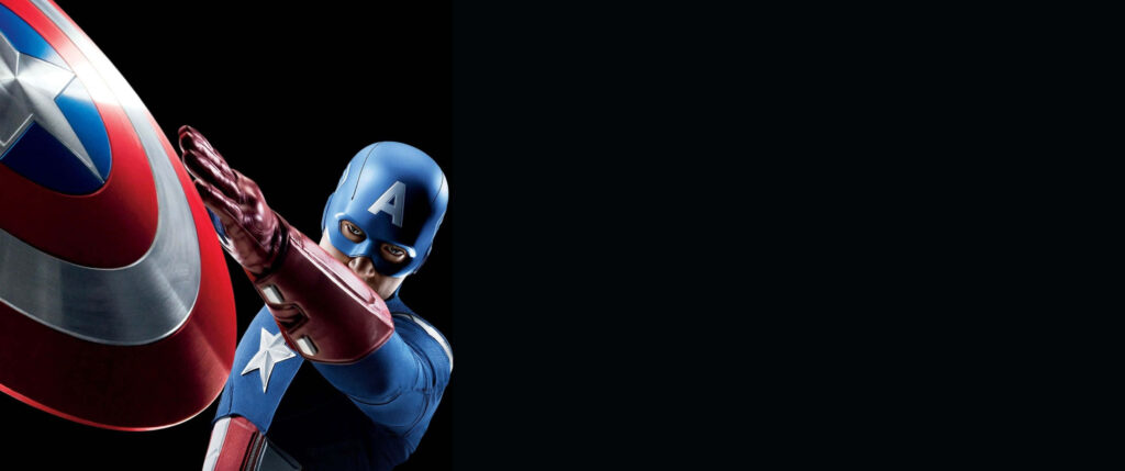 Symbol of Heroic Resolve: Captain America's Iconic Shield Shines against a Majestic Sky Wallpaper