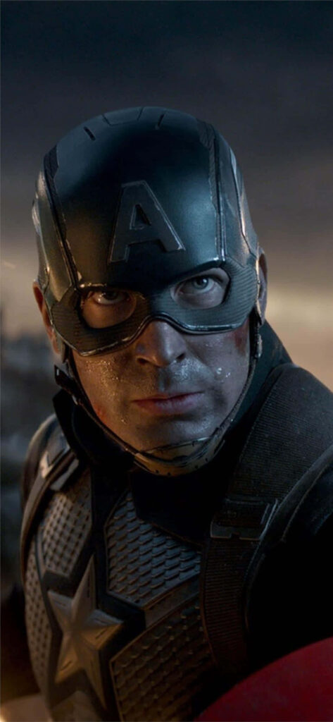 Captain America: The Marvel Superhero in Heroic Attire, Bearing his Iconic Shield - Immersive Background Image Wallpaper