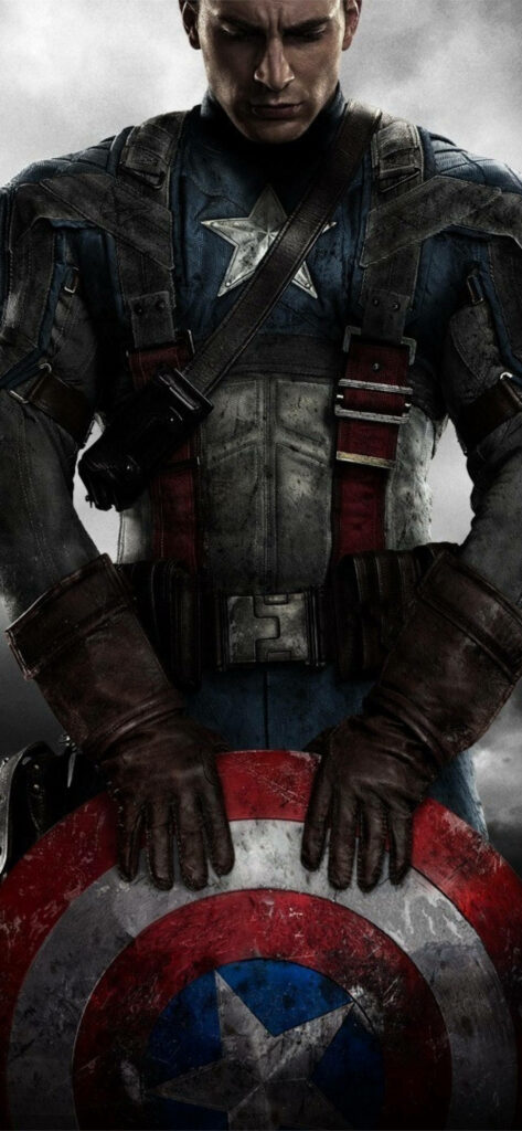 Captain America in iconic suit holding star shield against dramatic cloudy heroic background wallpaper