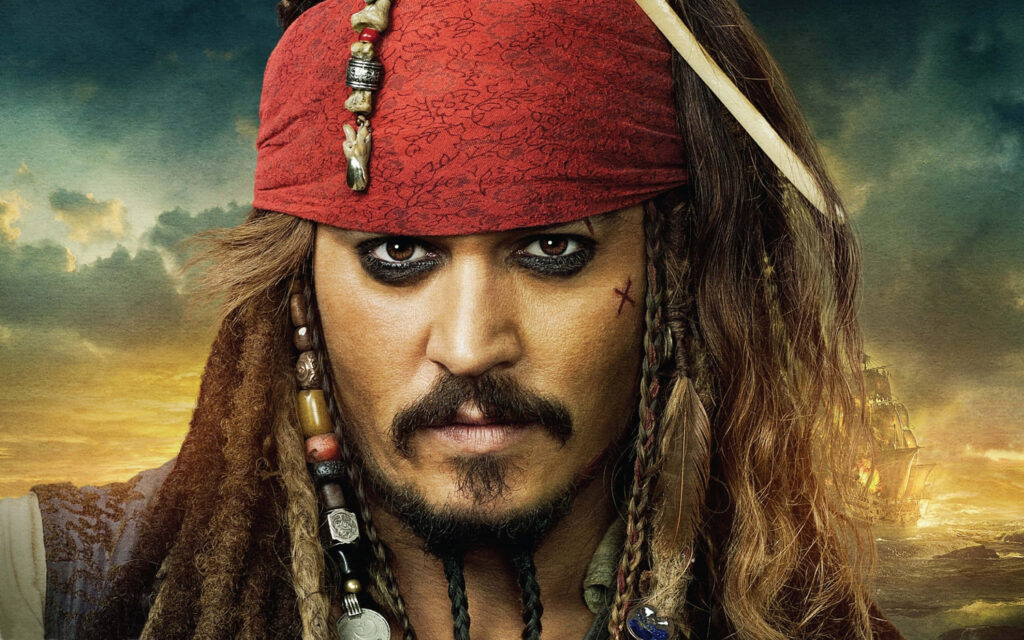 Captain Jack Sparrow on windswept cliff with dramatic sky and pirate ship Pirates of the Caribbean Wallpaper