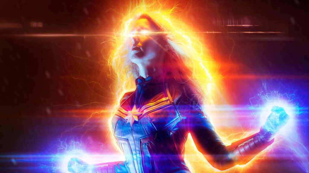 Captain Marvel: A Superhero's Soaring Resolve Over Urban Skies Wallpaper