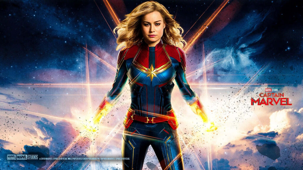 Glorious Captain Marvel Strikes a Dynamic Pose – Embracing Her Iconic Colors and Inspiring Strength Wallpaper