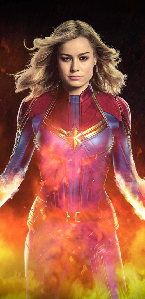 Captain Marvel: The Fierce and Mighty Kree Guardian Soaring Through the Stars Wallpaper