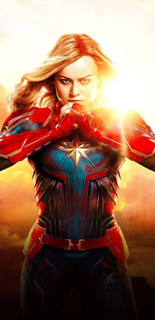 Empowering Might: Captain Marvel Embraces Her Heroic Destiny Wallpaper