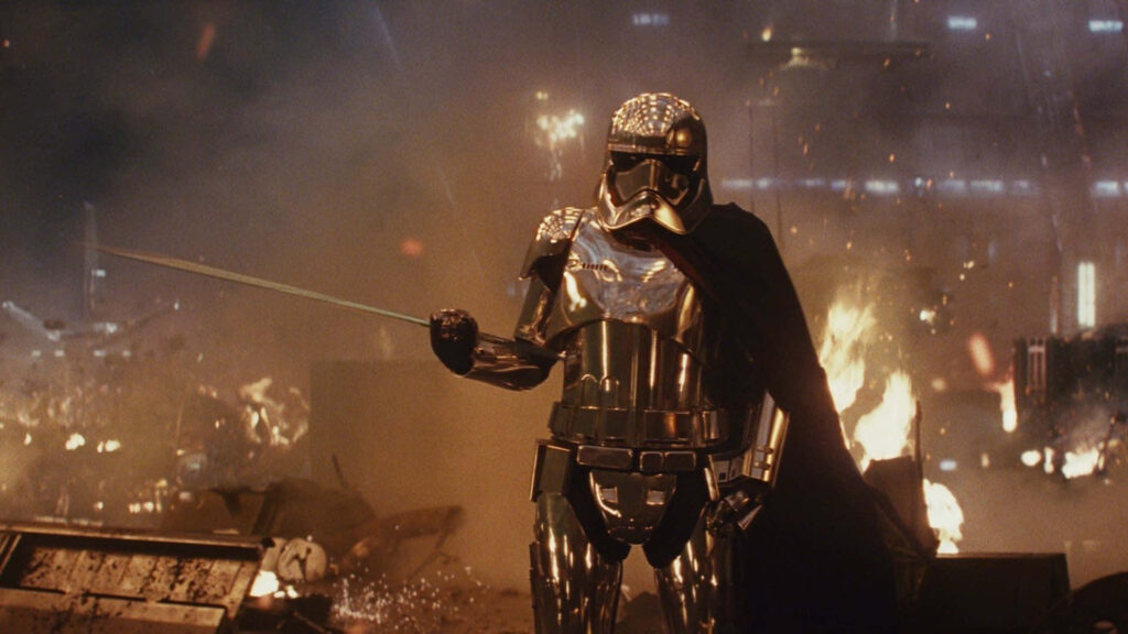 Captain Phasma in chrome armor with staff against fiery war background Star Wars wallpaper