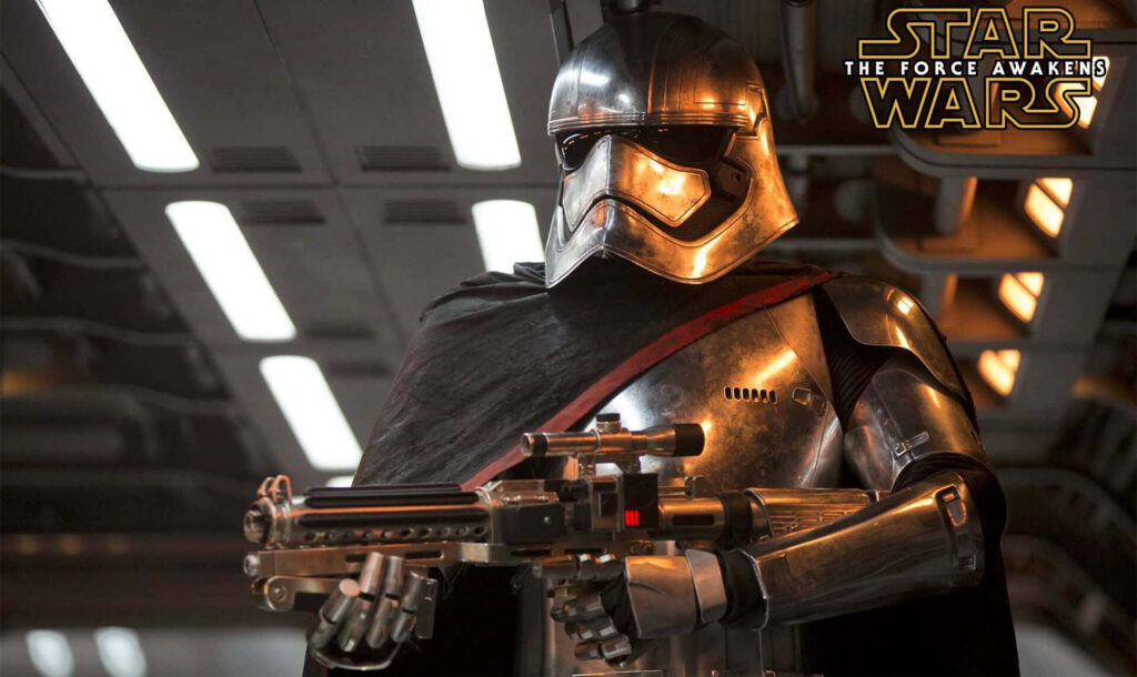 Captain Phasma in shiny chrome armor holding blaster rifle against mechanical Star Wars background Wallpaper