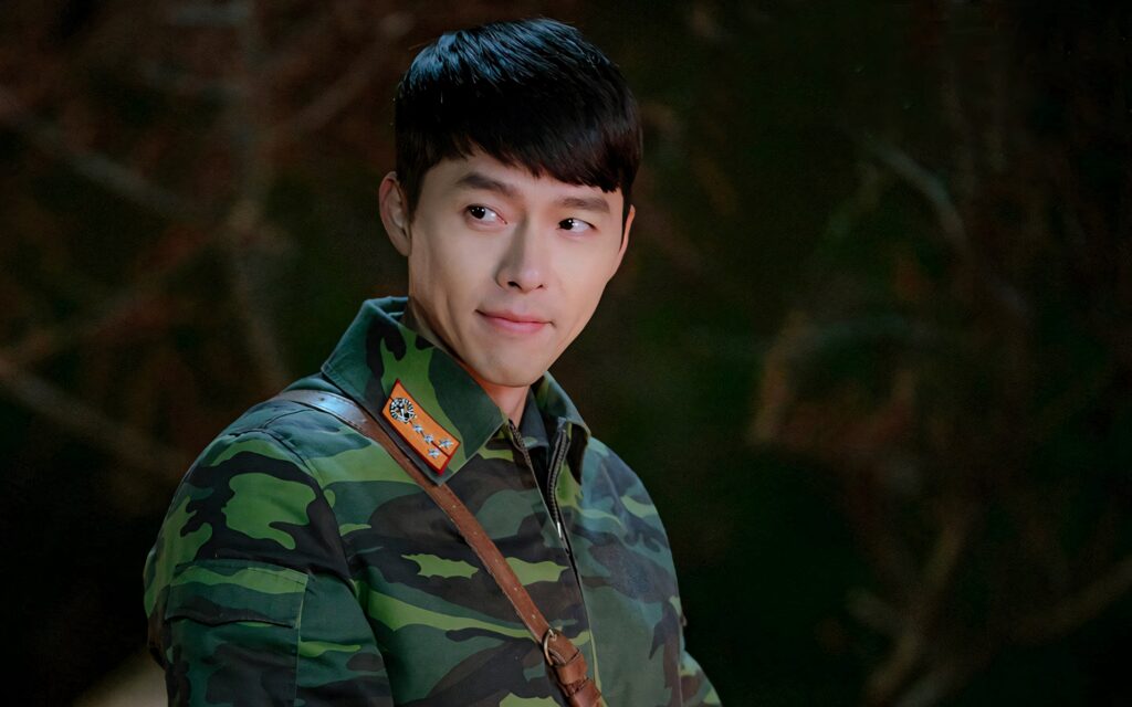 Captain Ri Crash Landing On You green camouflage uniform serious expression natural background Wallpaper