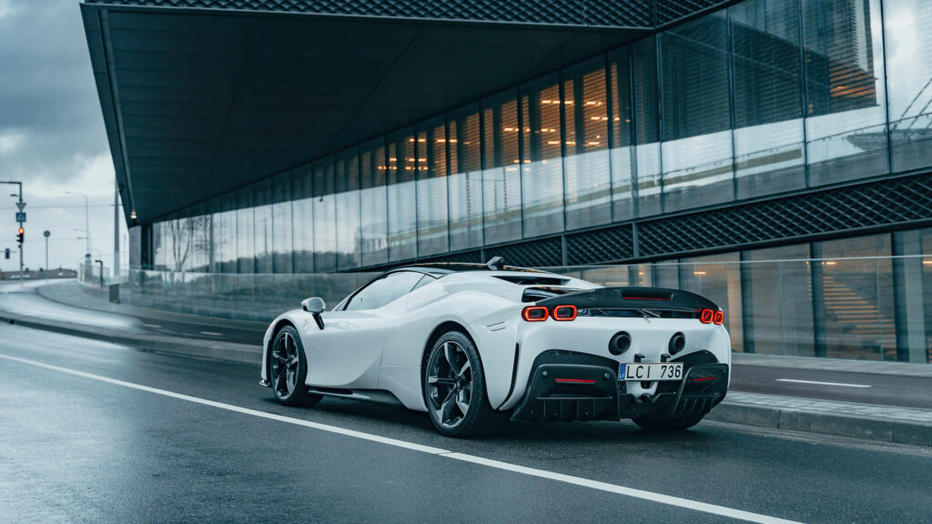 Dazzling Ferrari 1920x1080 Image: An Iconic Marvel Speeding through Urban Streets, Flaunting the Timeless Red: A Captivating Background! Wallpaper