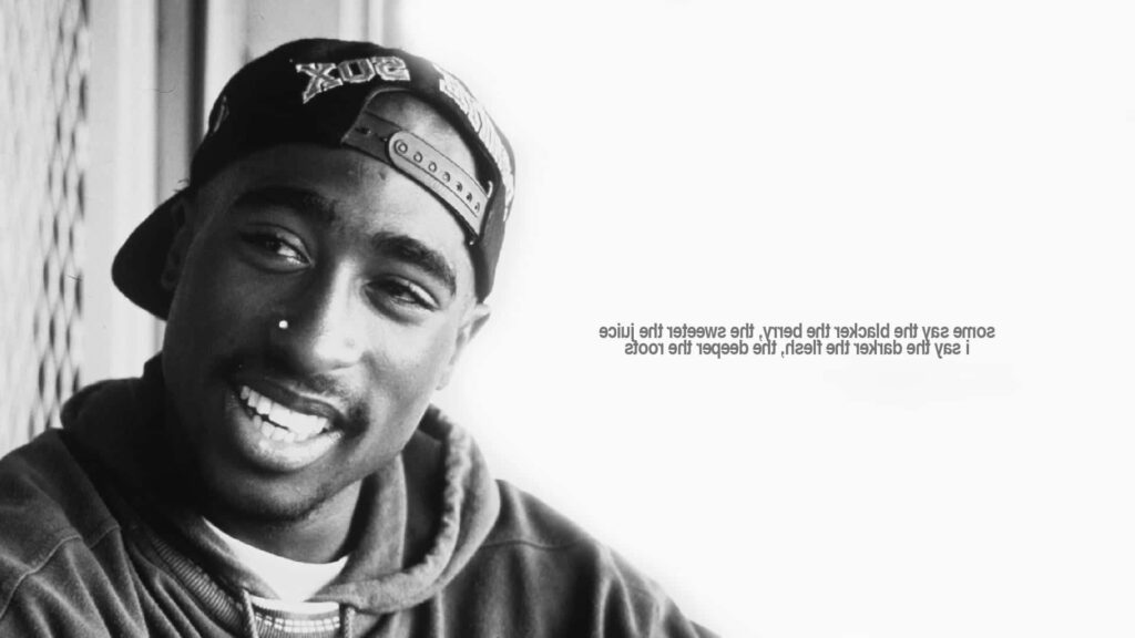 2pac's Empowering Words in a Captivating Still Frame Wallpaper