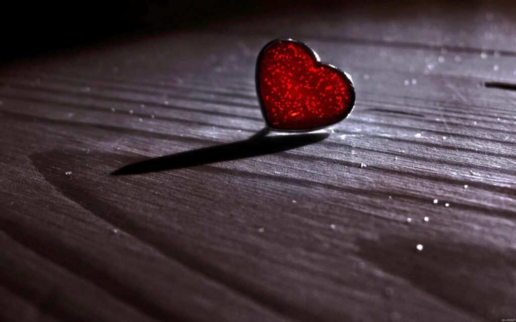 Elegant Glittering Red 3D Heart Wallpaper on Textured Wood Background