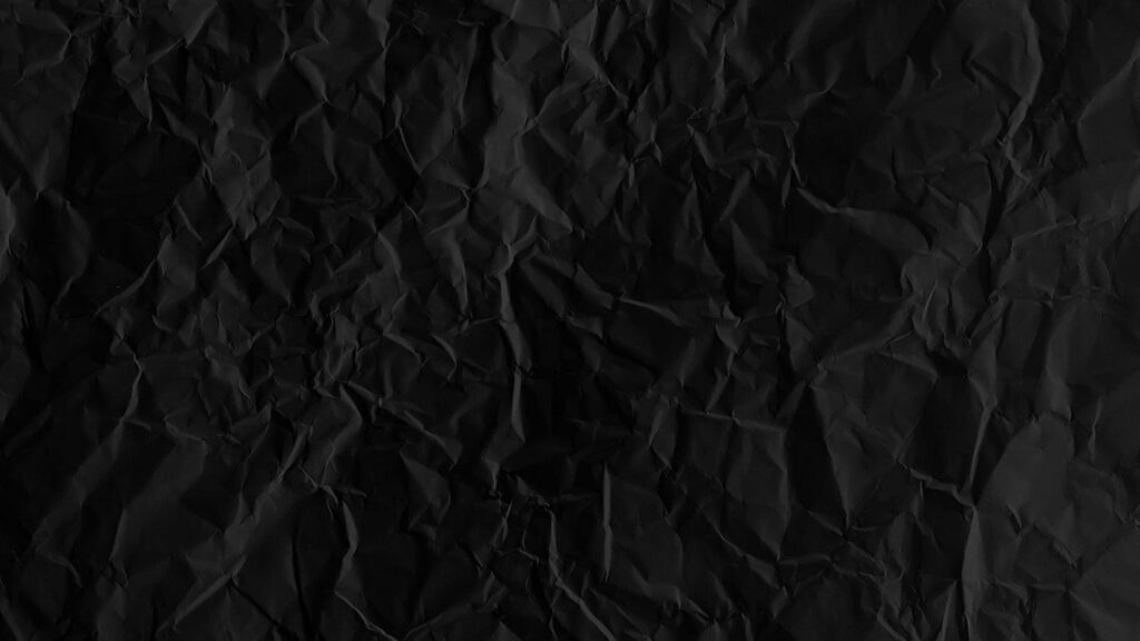 Inky Depths: A High-Resolution Snapshot of a Black Paper Texture Wallpaper