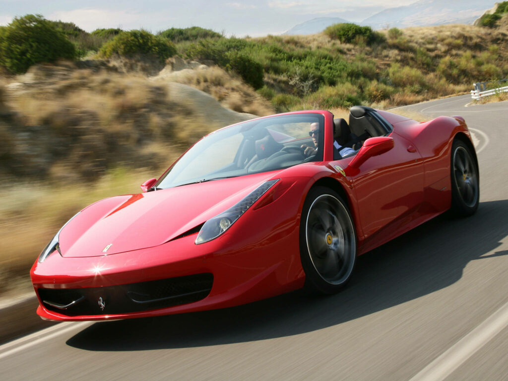 Exhilarating Speed: A Captivating Snapshot of the 4K Ferrari 458 Spider Red Car, Illuminated in a Stunning Long Exposure Shot, Surging Through the Vibrant Roadway Wallpaper