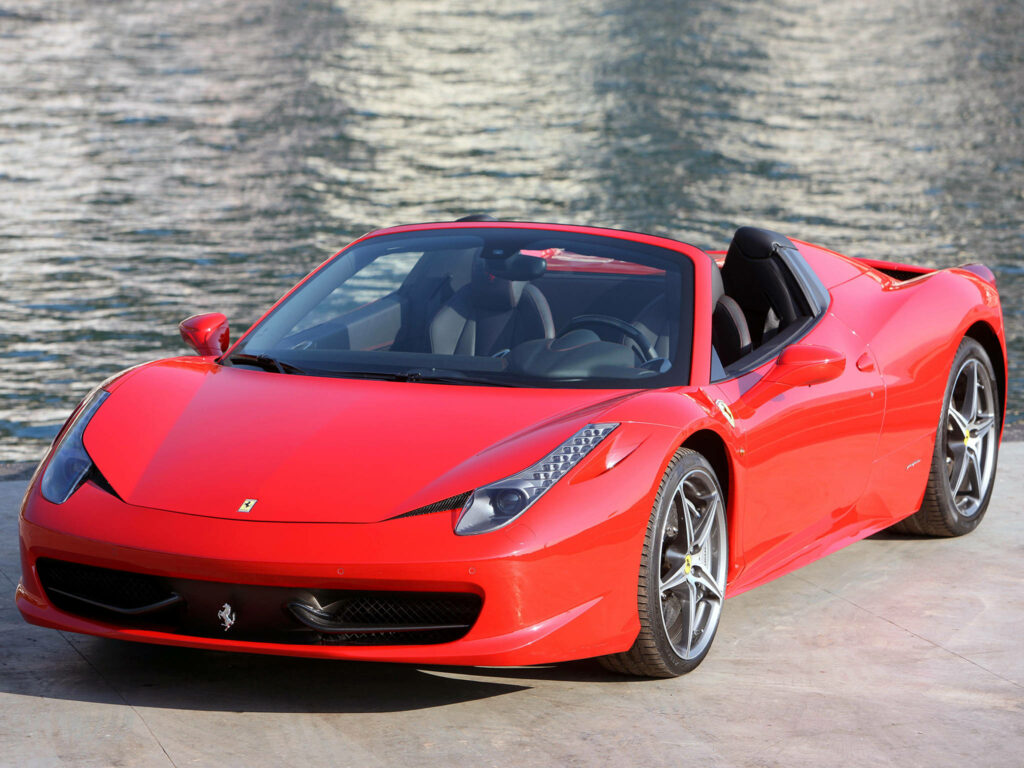 Ravishing Red 2012 Ferrari Spider: Sleek Car Model Glowing by the Water Wallpaper