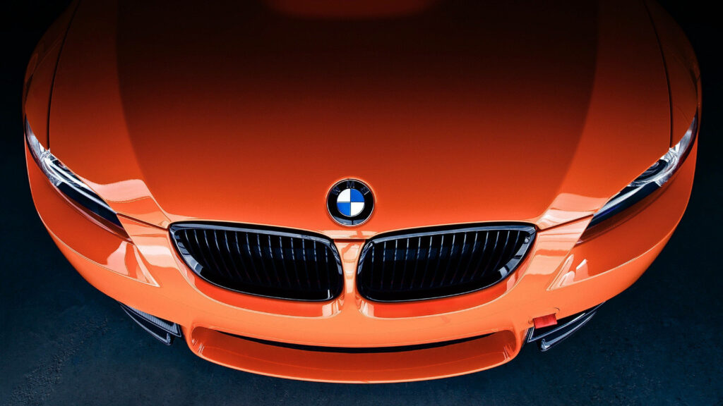 Top-Down View of a Sleek Orange BMW - 4K Wallpaper for Car Enthusiasts