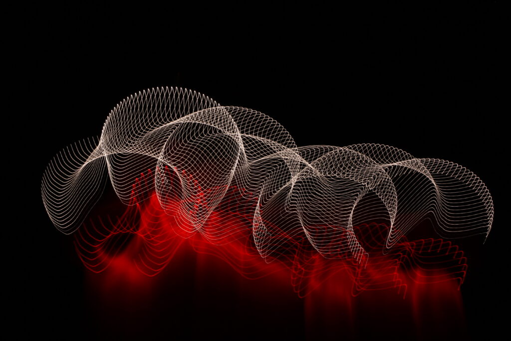 Captivating Abstract Wallpaper: Intricate Light Patterns on Dark Background