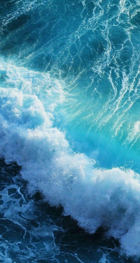 Ocean Bliss: A Stunning Aerial View of Majestic Waves - iPhone iOS 10 Background Wallpaper