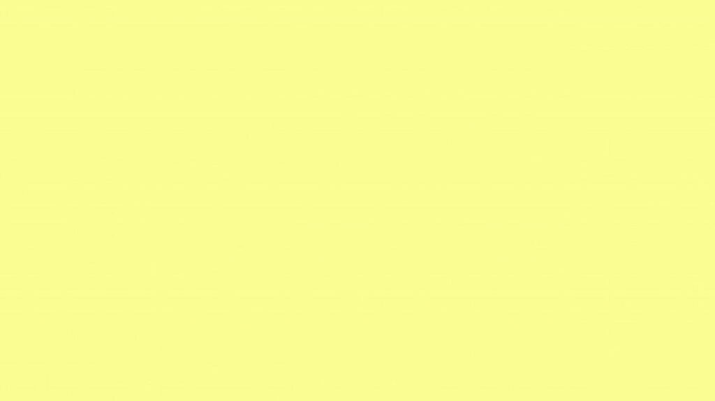 Glowing Elegance: A Captivating Solid Pastel Yellow Wallpaper Embraces the Background