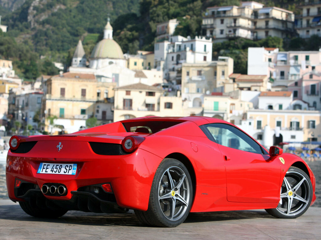 Captivating Rear View Photo of 4K Ferrari Italia Car Model in Striking Red Shade, Set Against Urban Backdrop Wallpaper