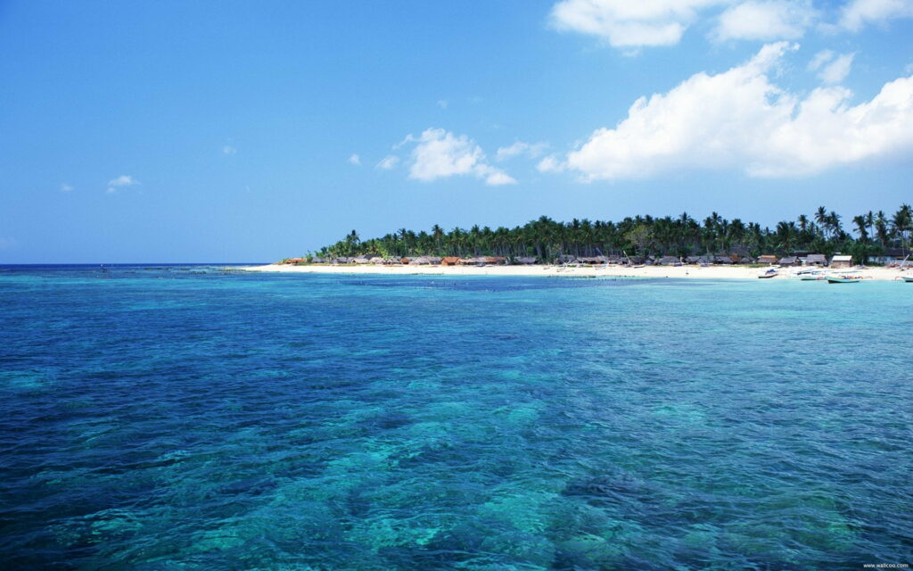 Paradise Unleashed: Bali's Majestic Azure Sky Captured in HD Wallpaper