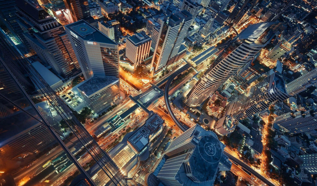 The Majestic Skyline of Bangkok: Captivating HD Aerial Photography Showcasing Towering Urban Landscapes Wallpaper