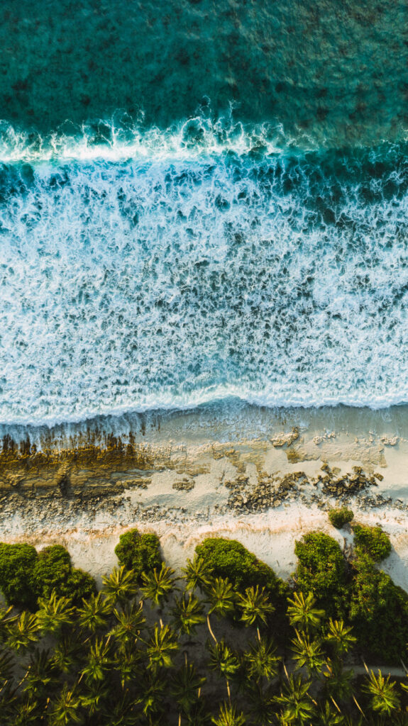 Serenity from Above: Captivating Aerial iPhone XR Wallpaper Showcasing Beach Waves with Aesthetic Appeal