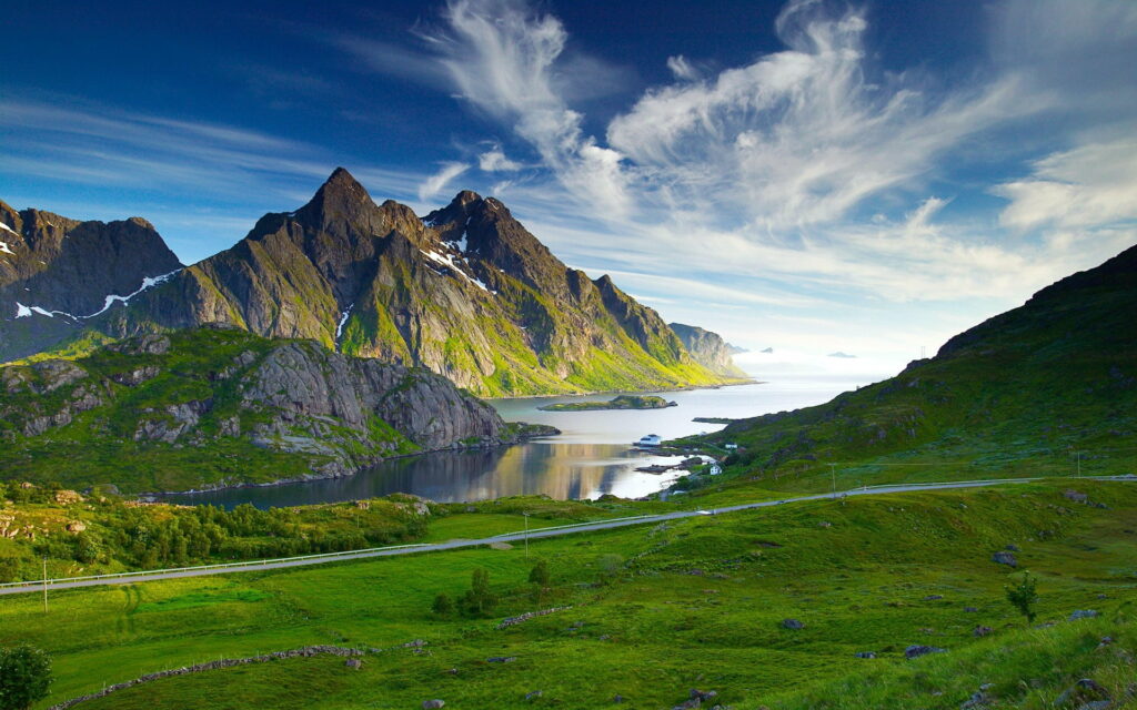 Majestic Mountain Peaks: A Breathtaking HD Wallpaper Portrait of Pristine Nature with a Scenic Skyline, Sparkling Waters, and Enchanting Scenery