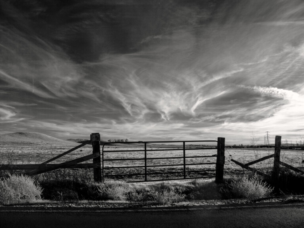Captivating Black and White Rural Scene Wallpaper with Sky and Gate
