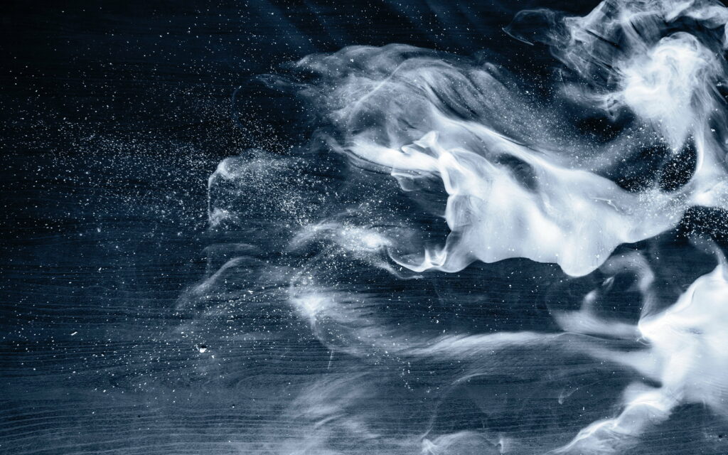 4K macro wallpaper of white smoke swirling on dark textured wood with navy blue background