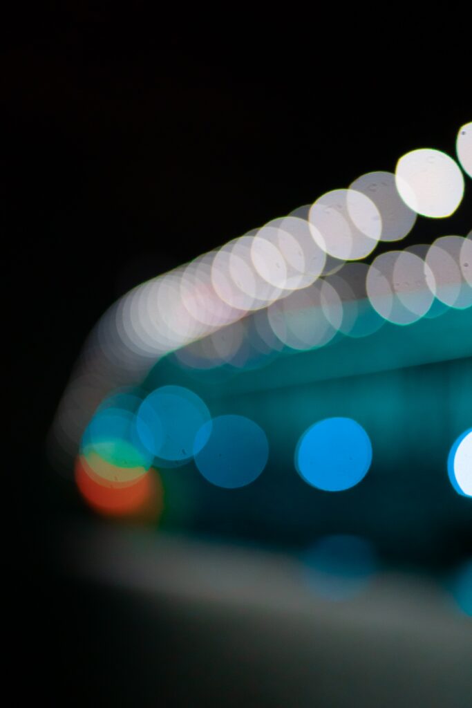 Serene Bokeh Wallpaper: Multicolored Lights on Dark Background