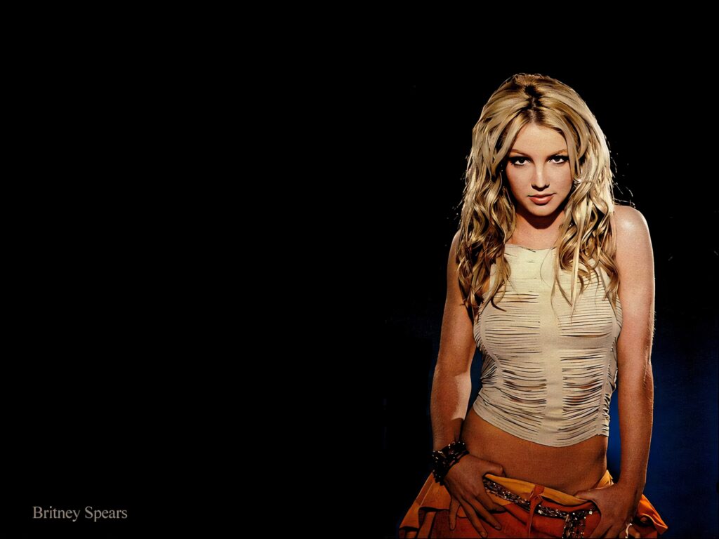 Britney Spears Captivating Wallpaper: Iconic Style on Dark Background